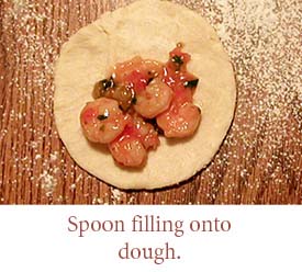 Spoon filling into dough