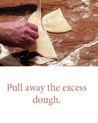 Pull away the excess dough